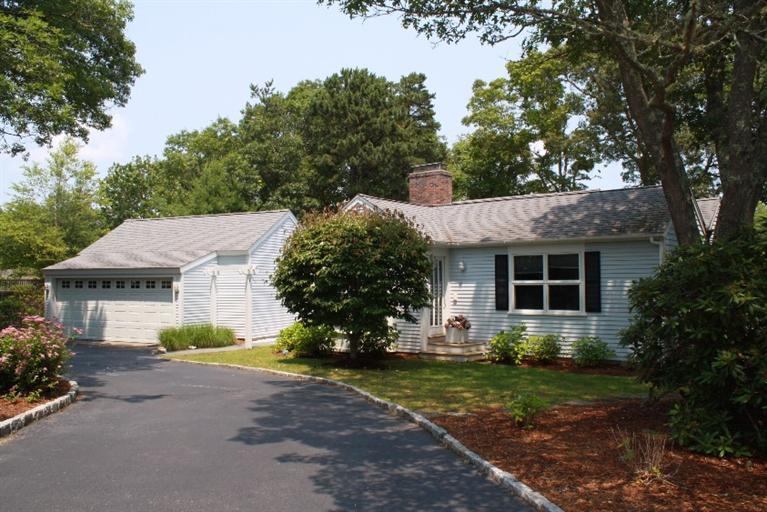118 Wading Place Road Mashpee, MA 02649 - Photo 5 of 32 a view of a house with yard and a garden