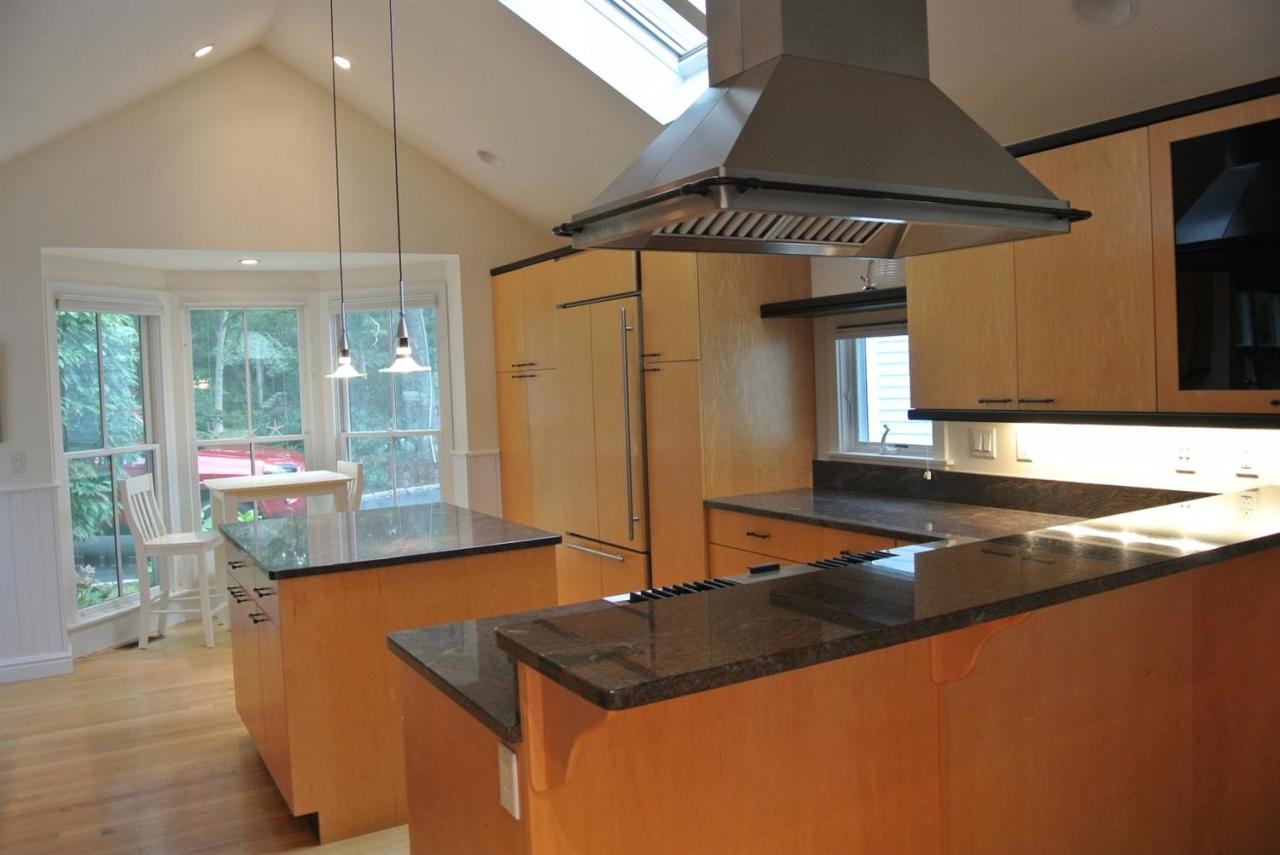 118 Wading Place Road Mashpee, MA 02649 - Photo 7 of 32 a kitchen with stainless steel appliances granite countertop a sink and a refrigerator