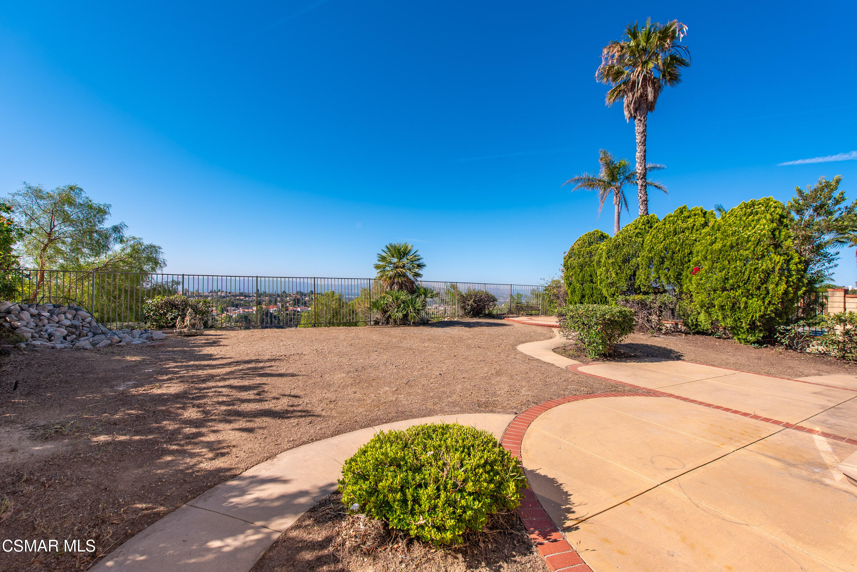 12036 Shadow Ridge Way Porter Ranch, CA 91326 - Photo 3 of 35 a street view with a garden
