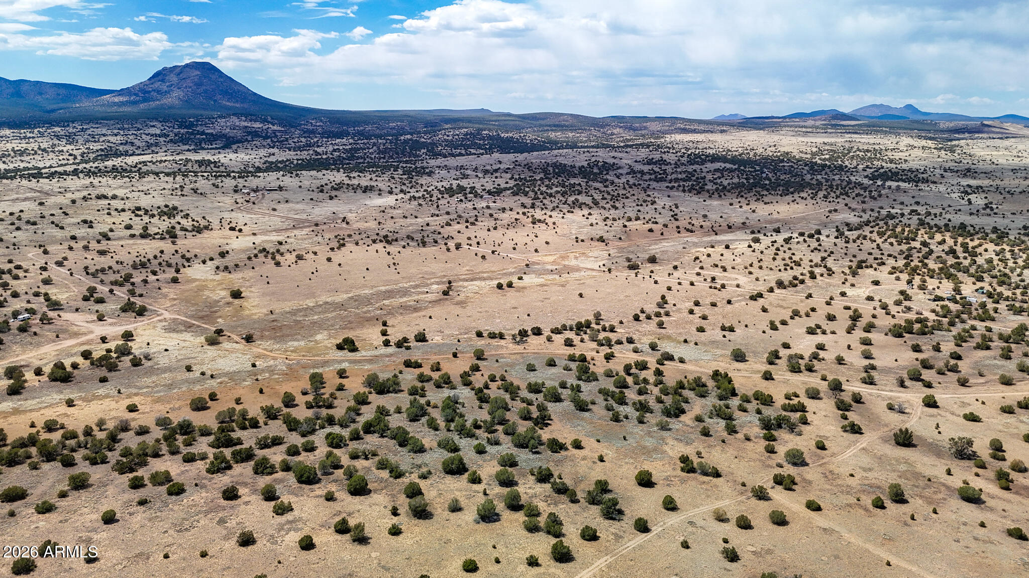 0 West Mile High Road, Unit 84 Ash Fork, AZ 86320 - Photo 10 of 25 a view of a dry yard with wooden floor and a mountain view