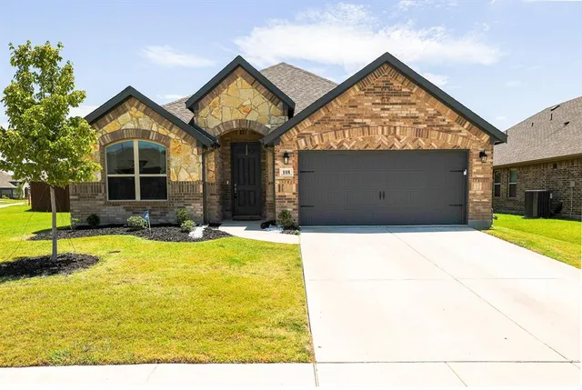 a view of a house with large outdoor space and a car parked in front of it