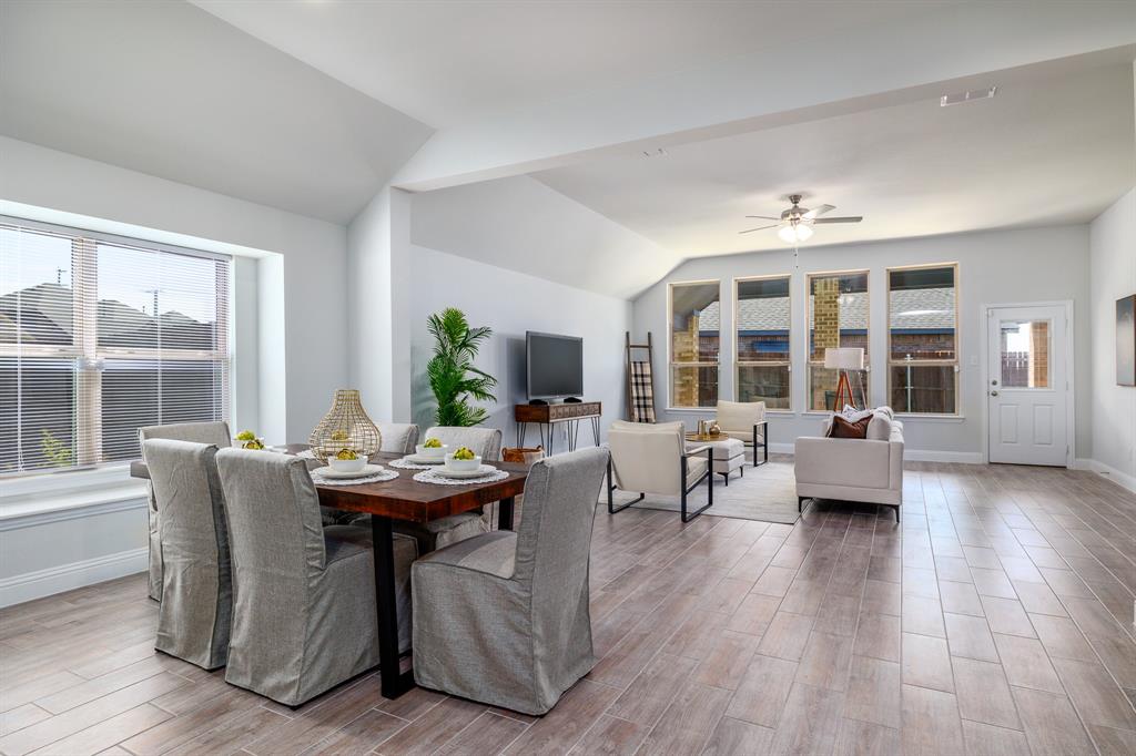 118 Sycamore Street Balch Springs, TX 75181 - Photo 11 of 34 a living room with fireplace furniture and a large window