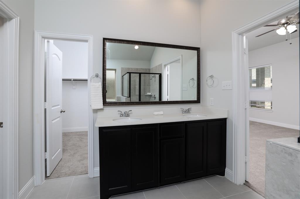 118 Sycamore Street Balch Springs, TX 75181 - Photo 25 of 34 a bathroom with a sink and a mirror