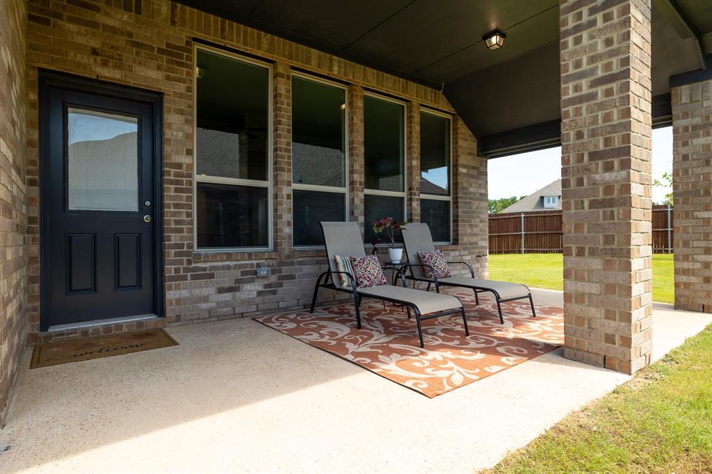 118 Sycamore Street Balch Springs, TX 75181 - Photo 32 of 34 a building outdoor space with patio furniture and potted plant