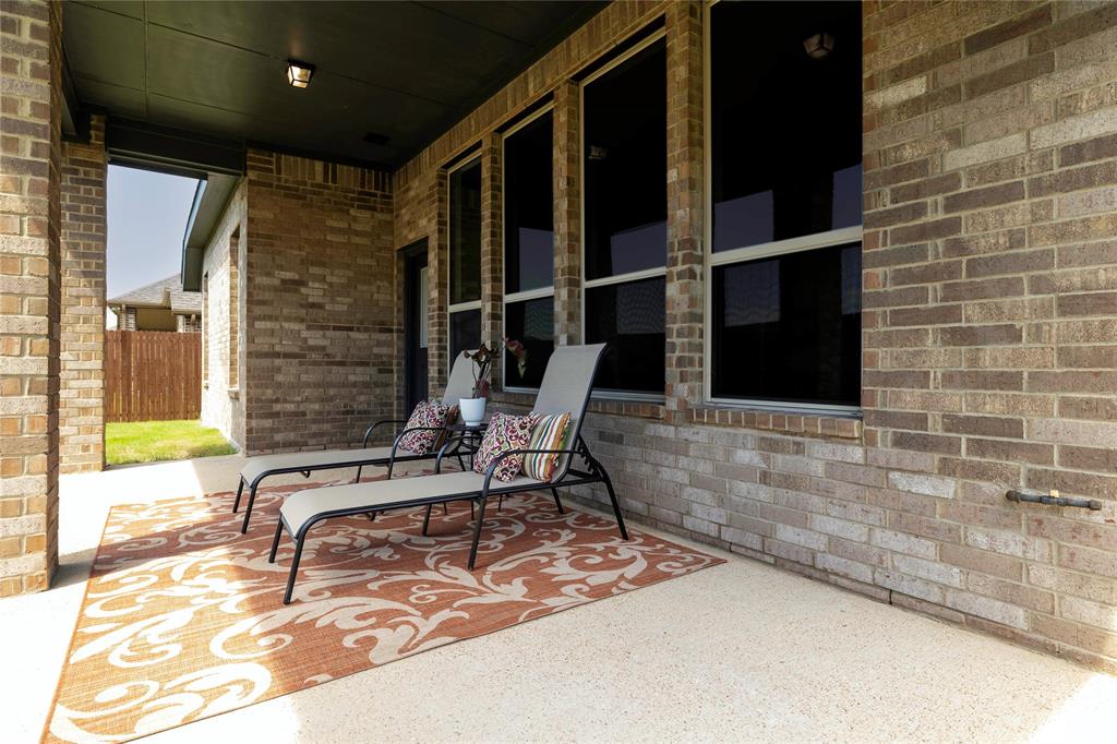 118 Sycamore Street Balch Springs, TX 75181 - Photo 33 of 34 a building outdoor space with patio furniture and windows