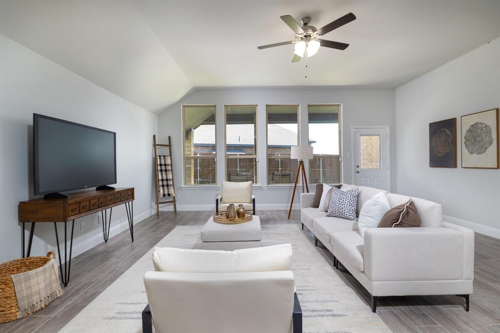 118 Sycamore Street Balch Springs, TX 75181 - Photo 7 of 34 a living room with furniture and a flat screen tv