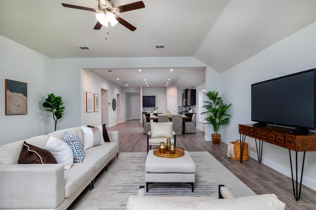 118 Sycamore Street Balch Springs, TX 75181 - Photo 8 of 34 a living room with furniture and a flat screen tv