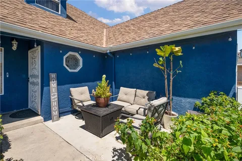 a view of a chairs and table in a patio
