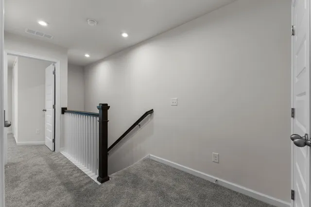 a view of a hallway with closet