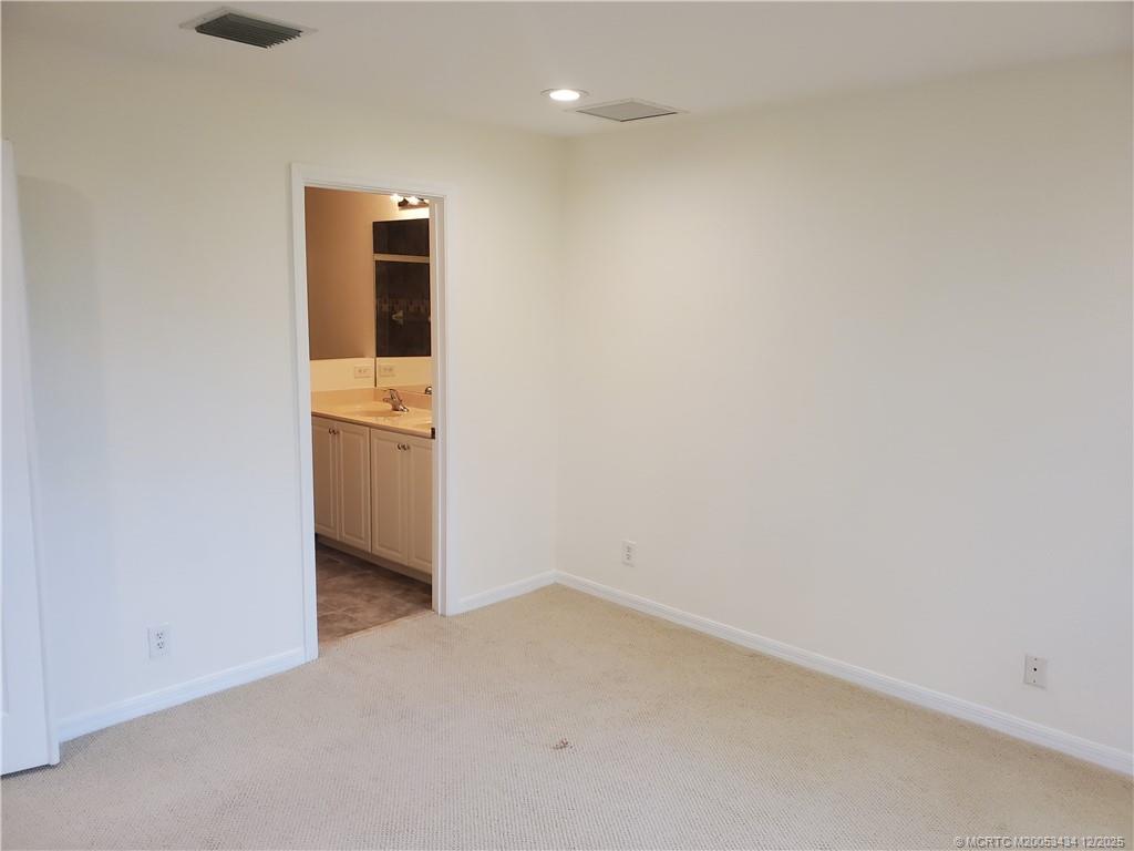 5309 Southeast Jennings Lane Stuart, FL 34997 - Photo 15 of 23 an empty room with cabinet