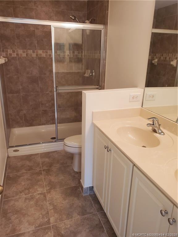 5309 Southeast Jennings Lane Stuart, FL 34997 - Photo 18 of 23 a bathroom with a sink and a mirror