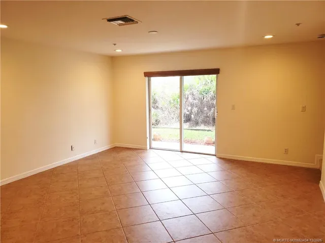 a bedroom with bed and a window