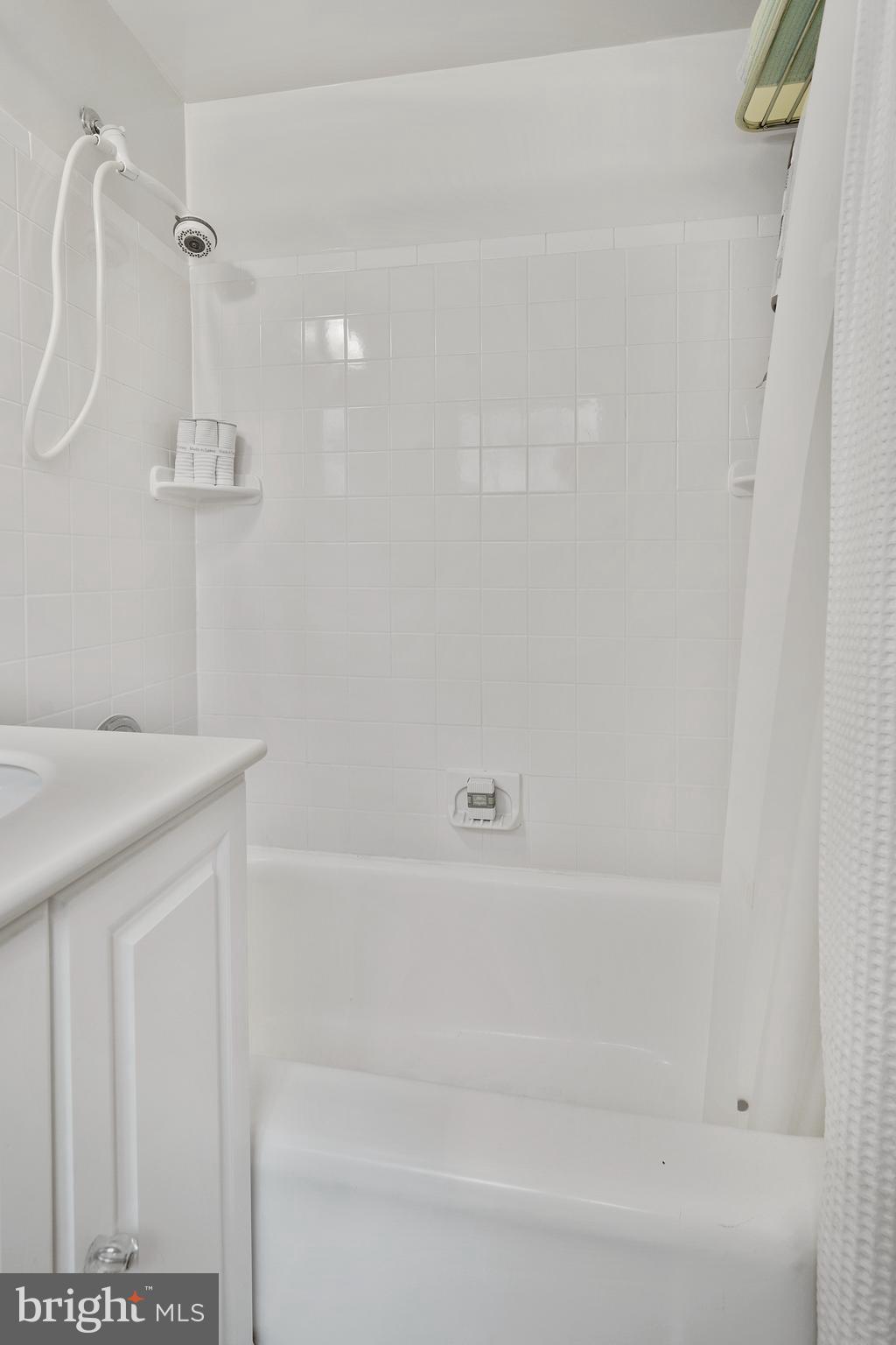 1762 Preston Road Alexandria, VA 22302 - Photo 17 of 34 White tile shower.