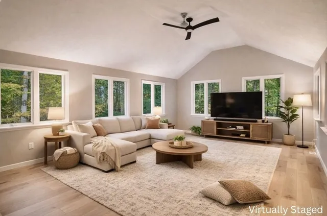 a front view of a house with a garden and yard