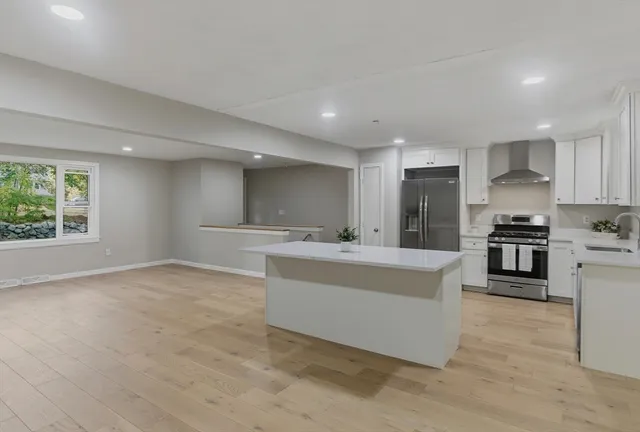 a bathroom with a sink a mirror and toilet