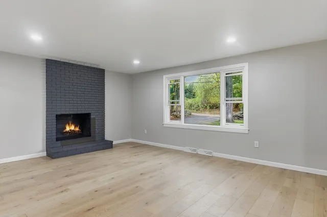 a kitchen with a sink stainless steel appliances and cabinets
