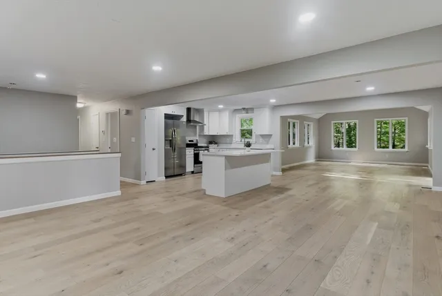 a living room with hard wood floors