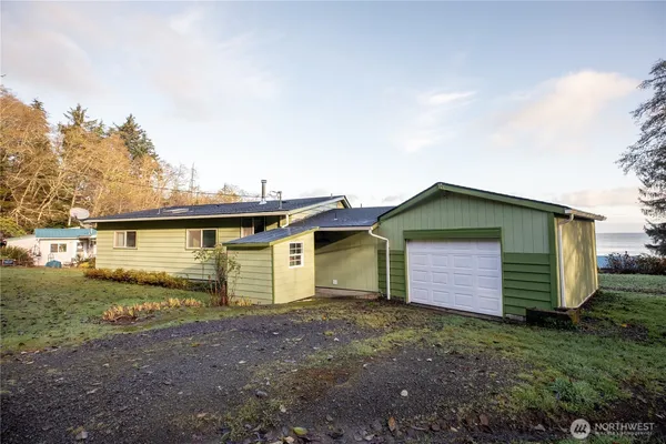 a view of a house with a backyard