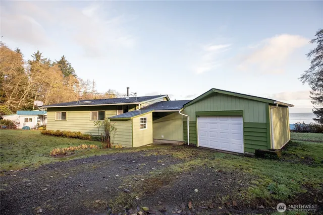 a view of a house with a backyard