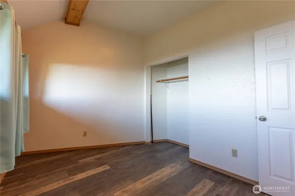 a kitchen with a refrigerator and a sink