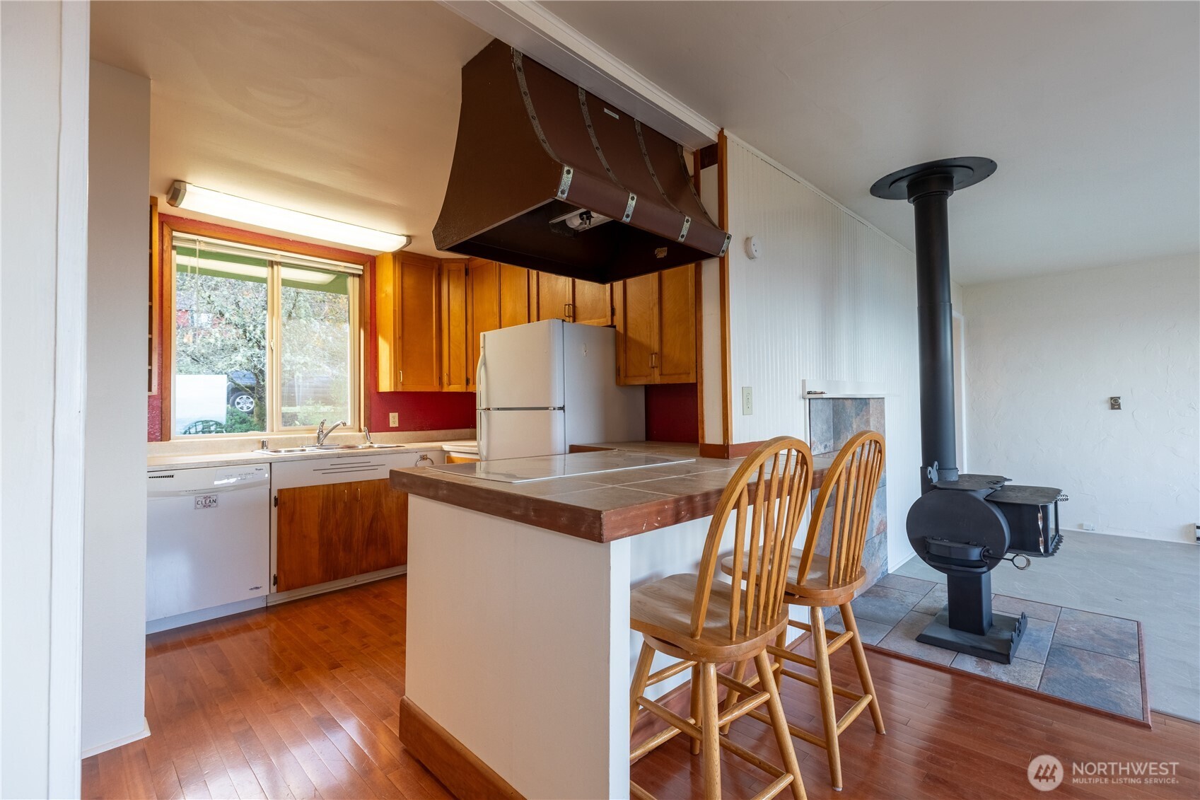 90 Dawnsridge Road Sekiu, WA 98381 - Photo 18 of 40 a kitchen with stainless steel appliances granite countertop a stove a sink and a microwave