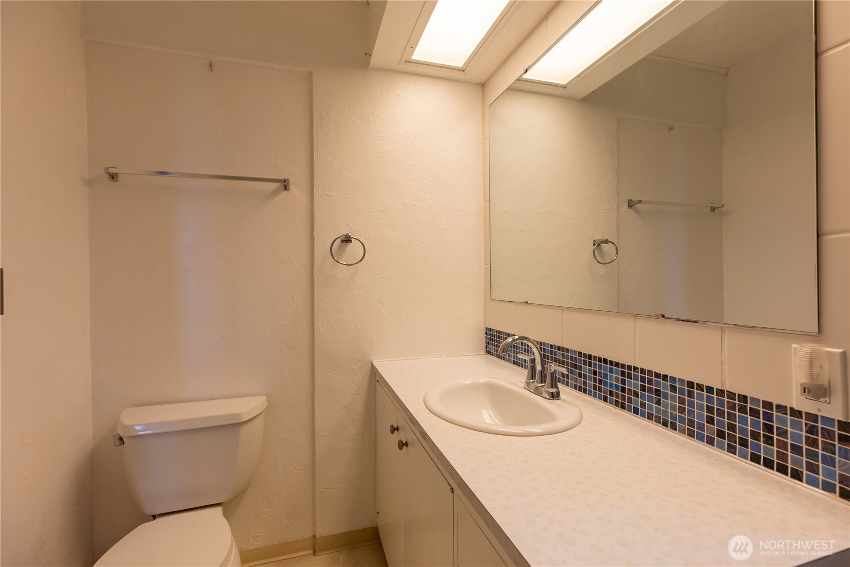 90 Dawnsridge Road Sekiu, WA 98381 - Photo 31 of 40 a bathroom with a granite countertop sink toilet and shower