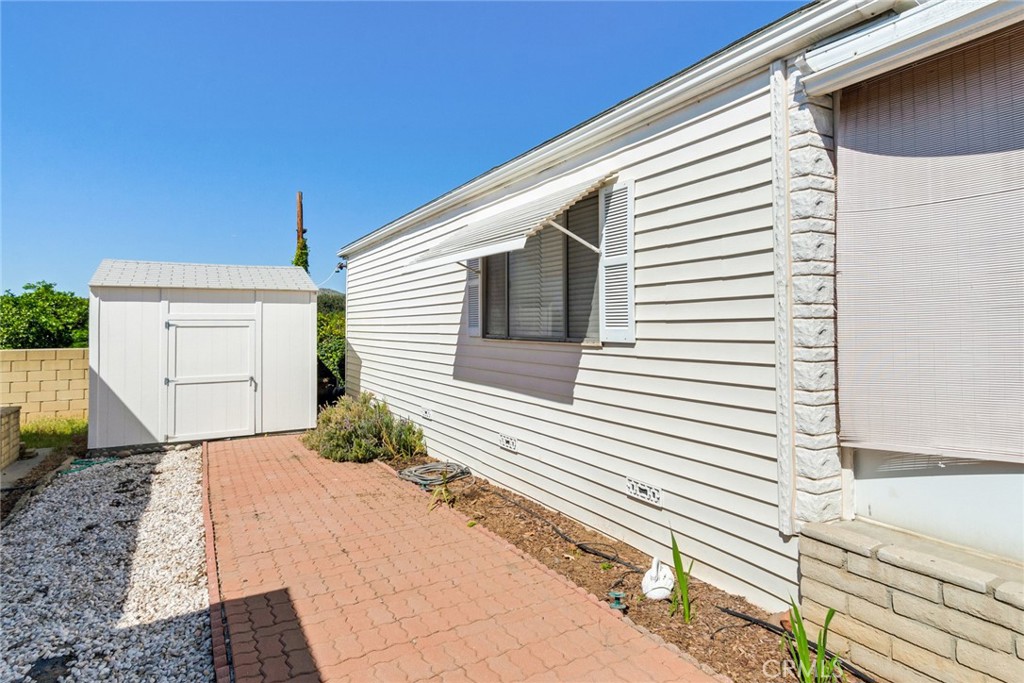 3500 Buchanan Street, Unit 173 Riverside, CA 92503 - Photo 24 of 29 Side of the house and the shed