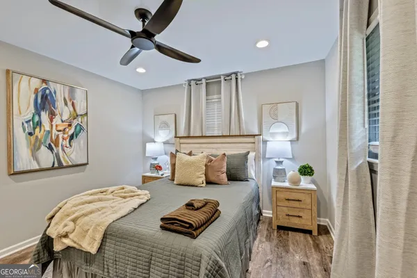 a bedroom with furniture and a chandelier