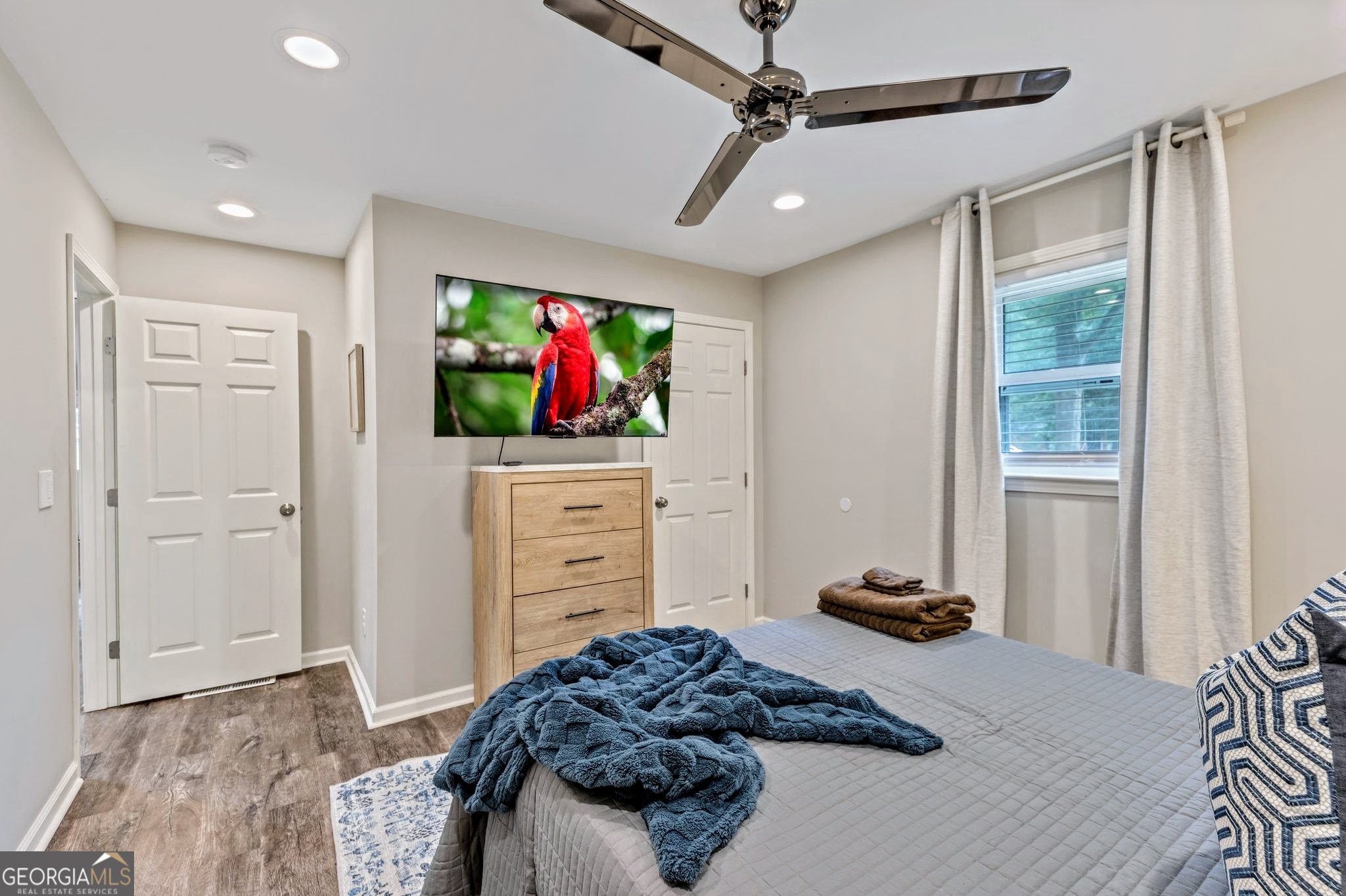 3590 Ponderosa Lane Powder Springs, GA 30127 - Photo 15 of 25 a bedroom with a bed and a flat screen tv