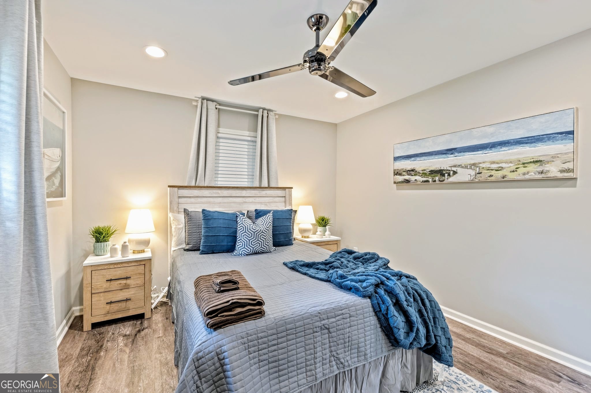 3590 Ponderosa Lane Powder Springs, GA 30127 - Photo 16 of 25 a bedroom with a bed and wooden floor