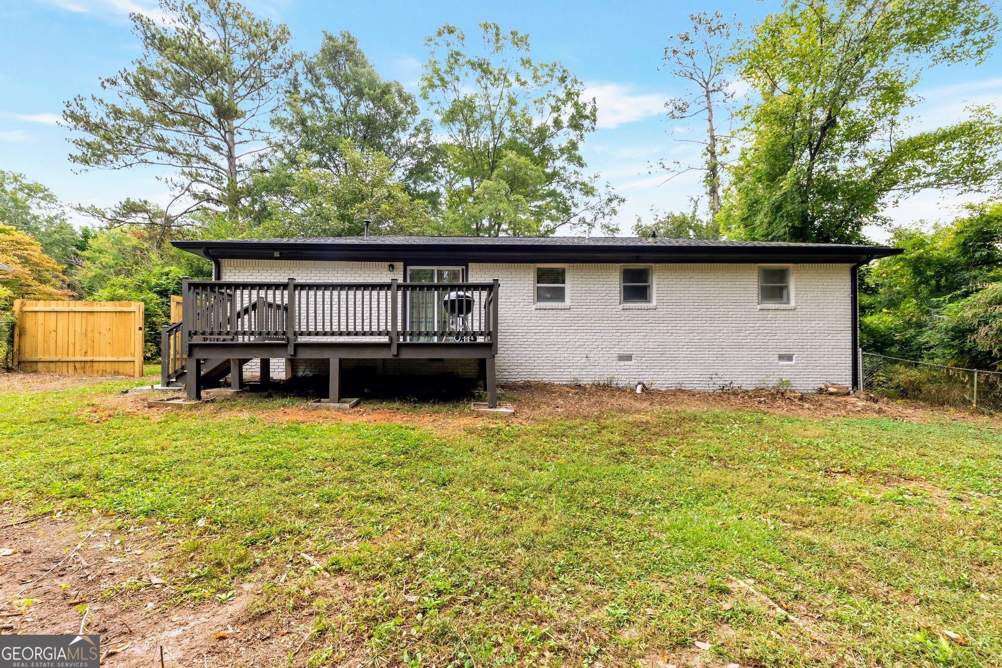 3590 Ponderosa Lane Powder Springs, GA 30127 - Photo 24 of 25 a backyard of a house with table and chairs