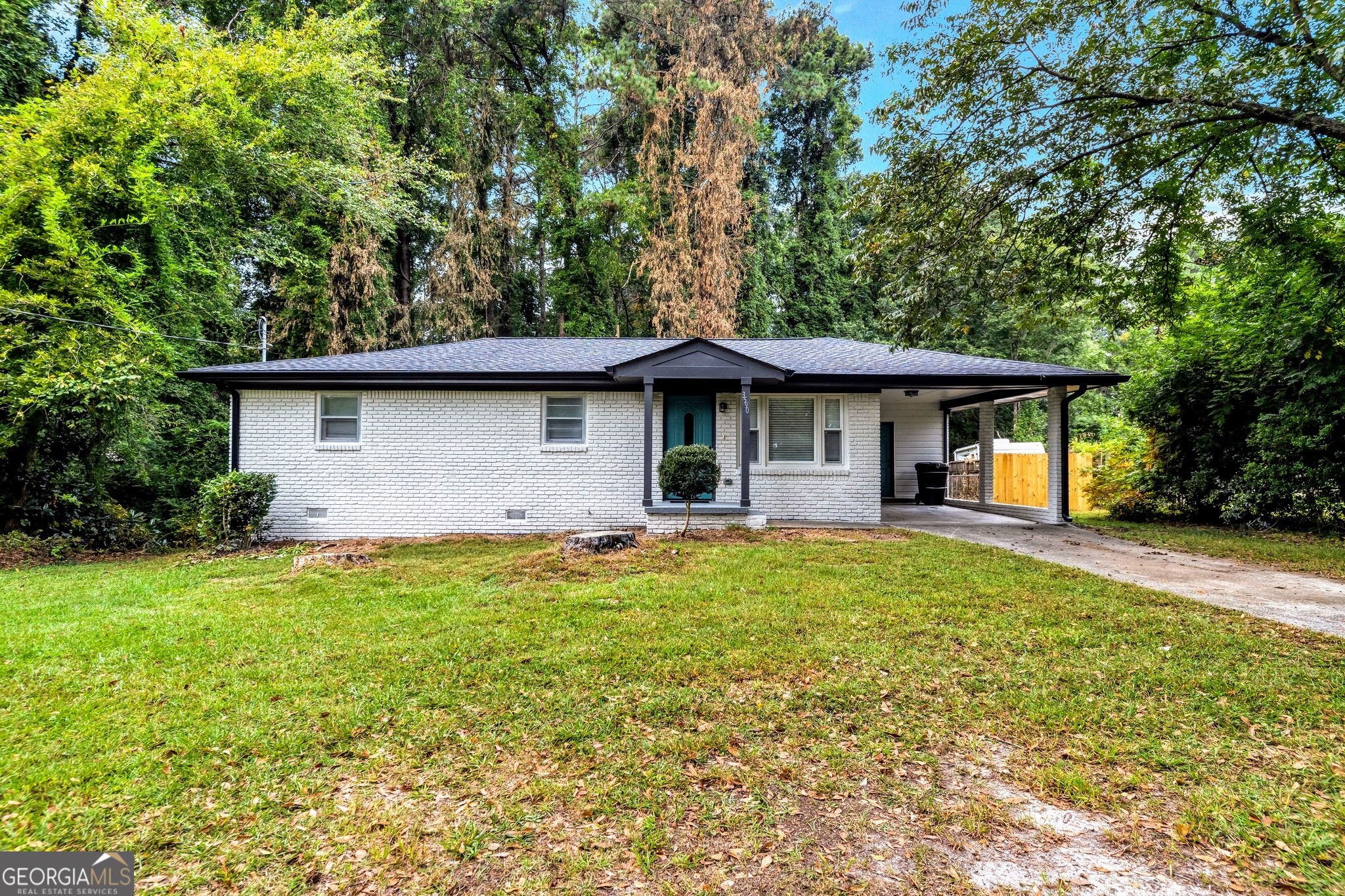 3590 Ponderosa Lane Powder Springs, GA 30127 - Photo 25 of 25 a front view of a house with a garden