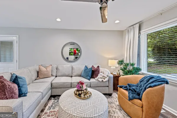 a living room with furniture and a large window