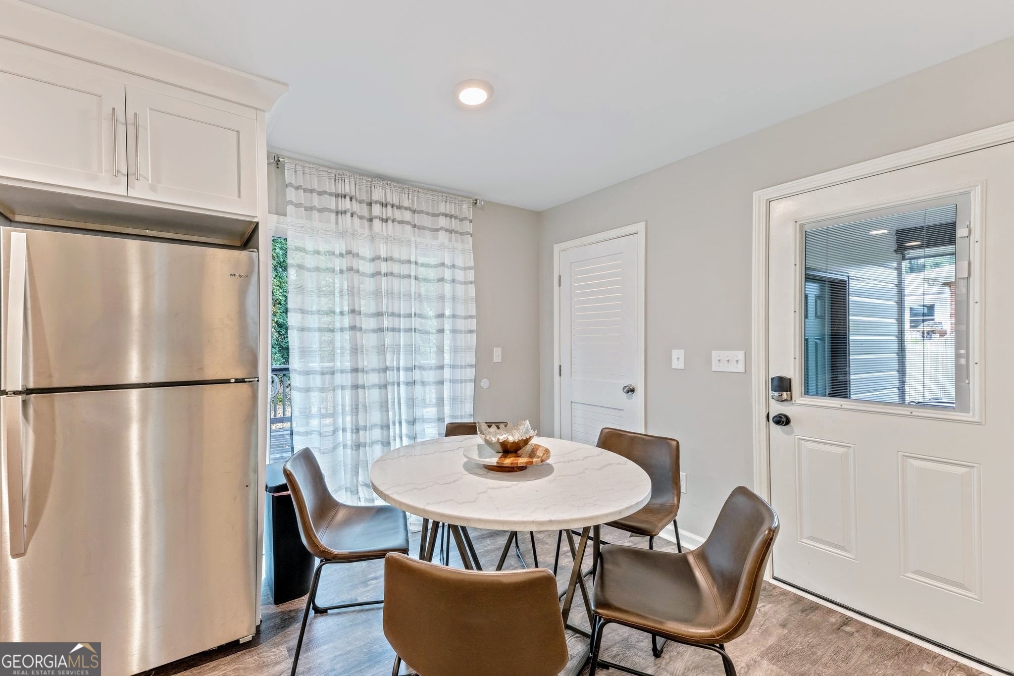 3590 Ponderosa Lane Powder Springs, GA 30127 - Photo 5 of 25 a kitchen with a table and chairs