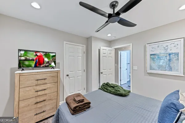 a bedroom with furniture and a dresser