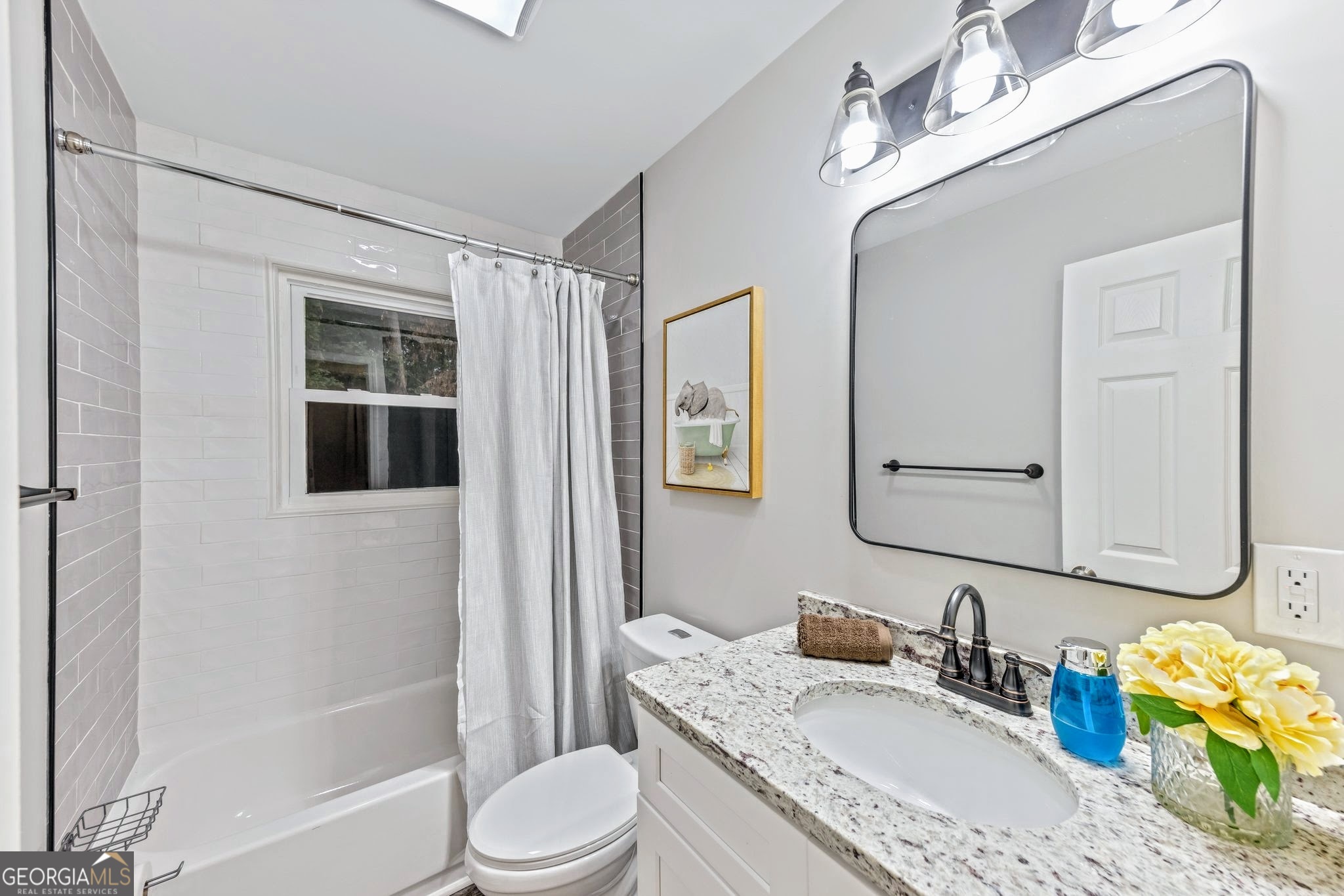 3590 Ponderosa Lane Powder Springs, GA 30127 - Photo 10 of 25 a bathroom with a granite countertop tub sink and mirror