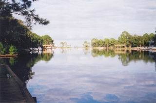 83 Anchor Lane Santa Rosa Beach, FL 32459 - Photo 1 of 1 a view of a lake with houses in outdoor space