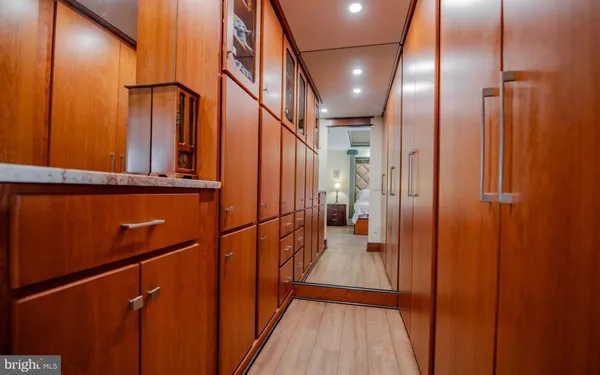 a bedroom with a bed and a ceiling fan