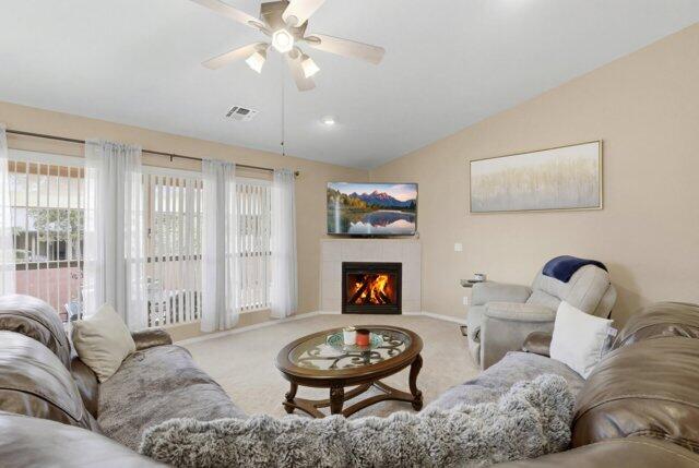 722 Boulder Ridge Road Payson, AZ 85541 - Photo 11 of 29 a living room with furniture and a fireplace