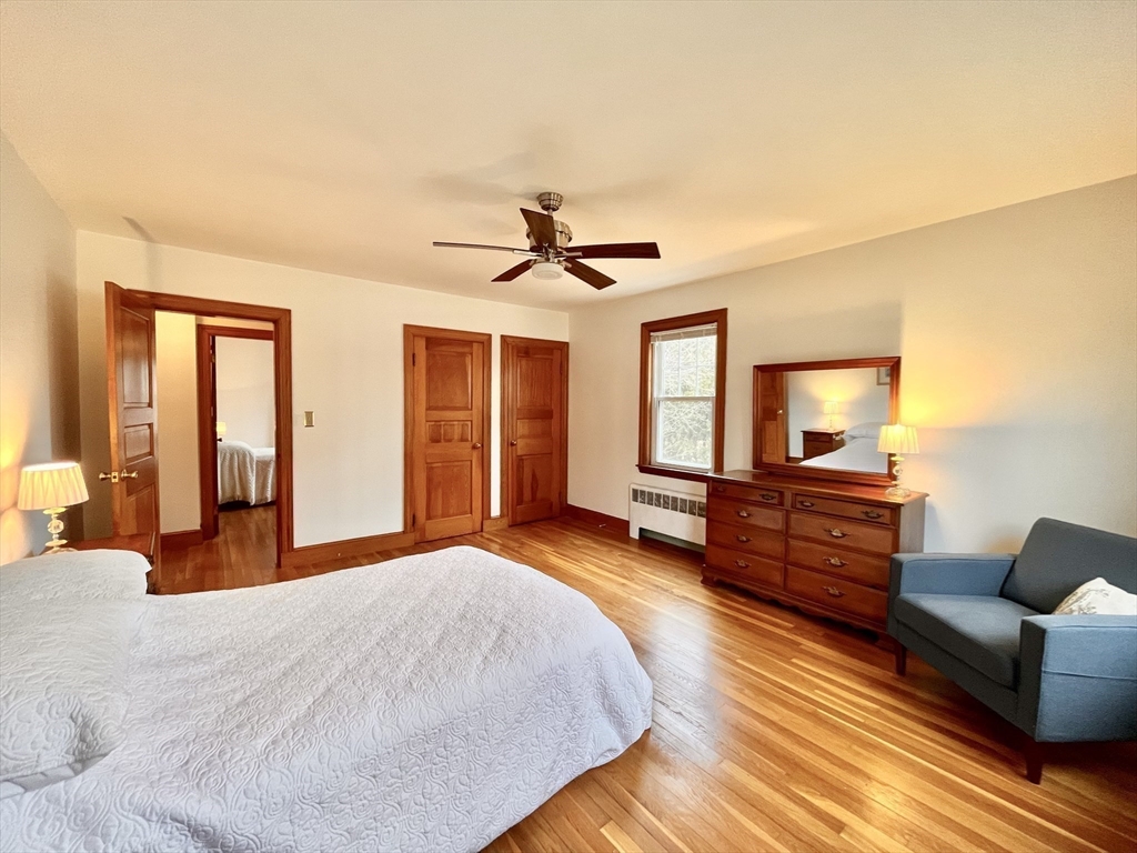 81 Topsfield Road Ipswich, MA 01938 - Photo 12 of 32 a bedroom with furniture and a window