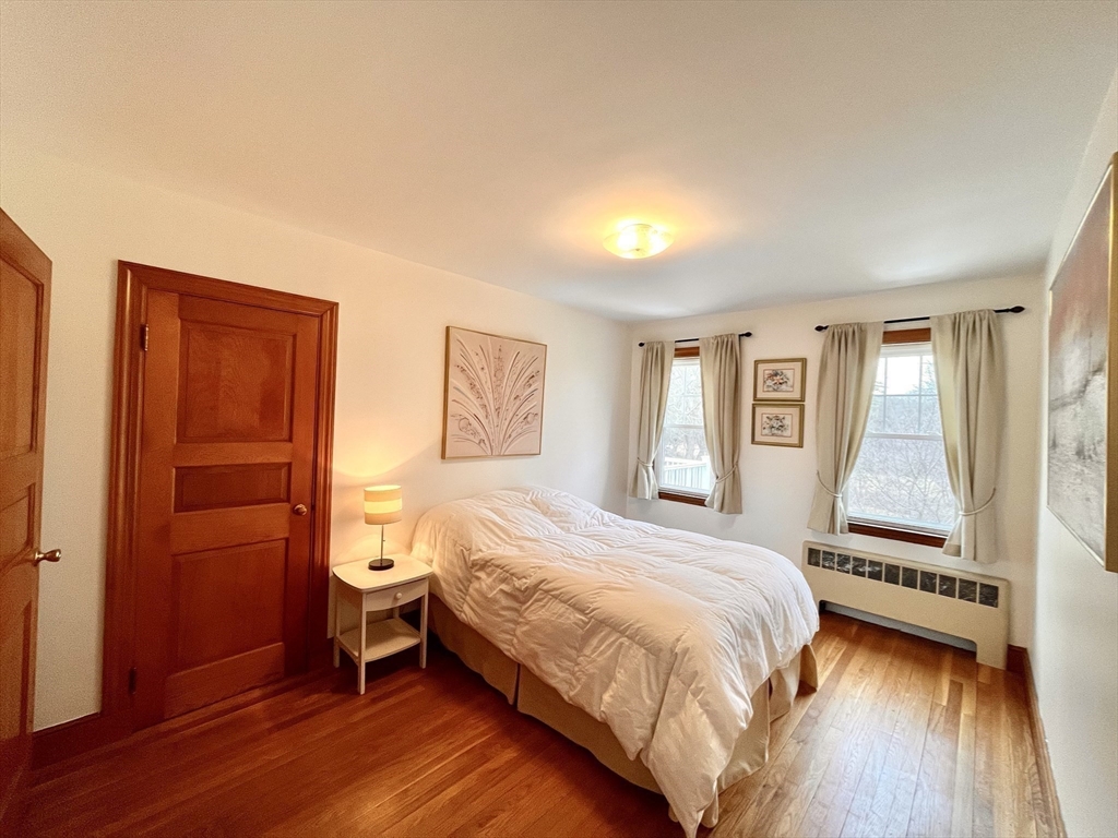 81 Topsfield Road Ipswich, MA 01938 - Photo 15 of 32 a bedroom with a bed and a window