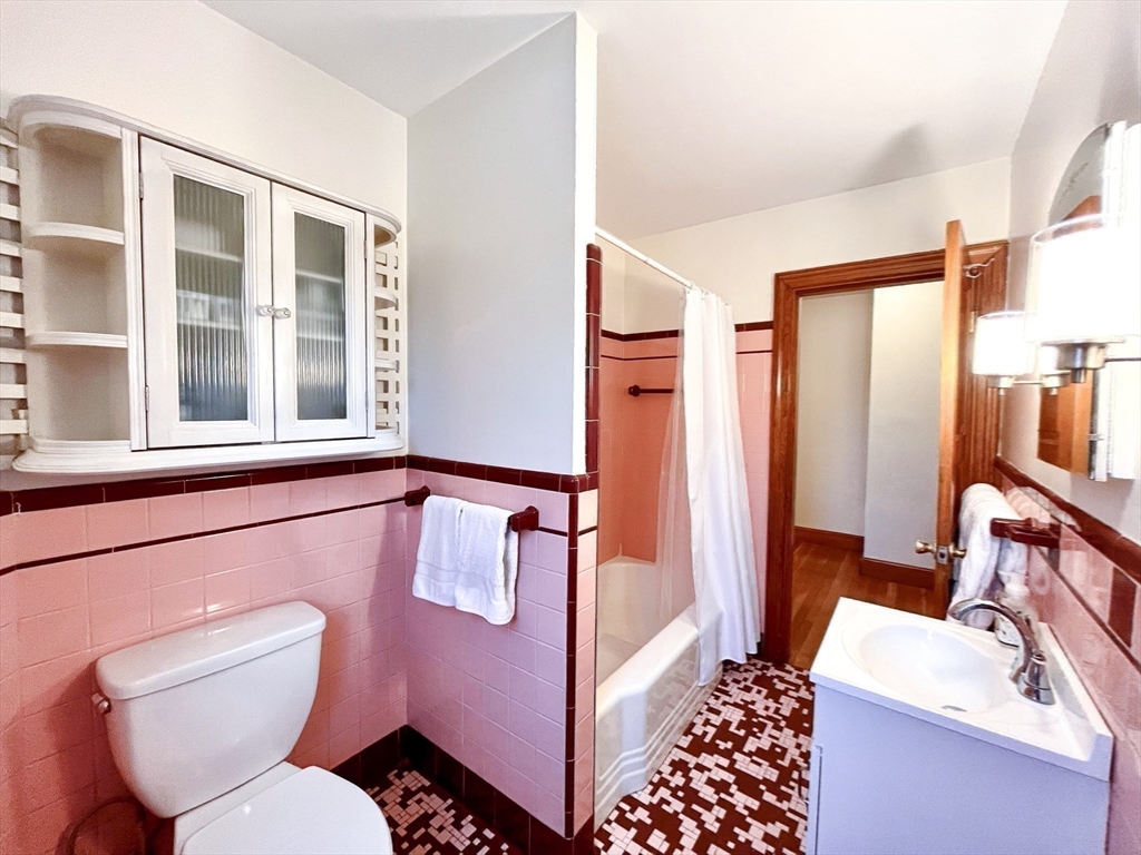 81 Topsfield Road Ipswich, MA 01938 - Photo 17 of 32 a bathroom with a toilet sink and mirror
