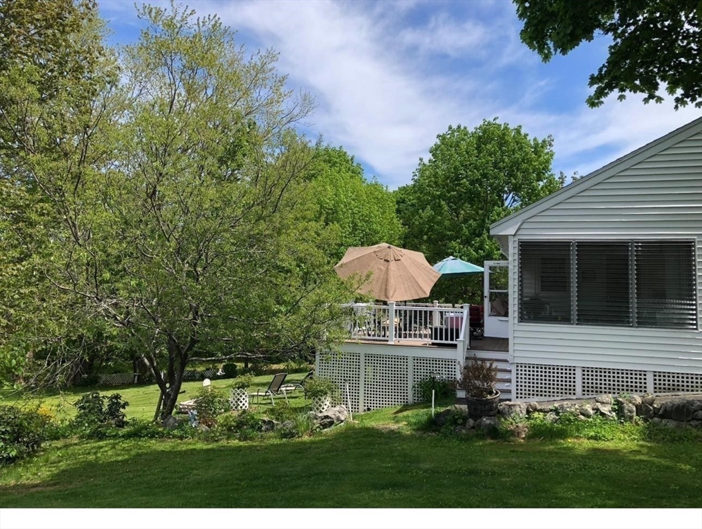 81 Topsfield Road Ipswich, MA 01938 - Photo 30 of 32 a view of a house with a yard and sitting area