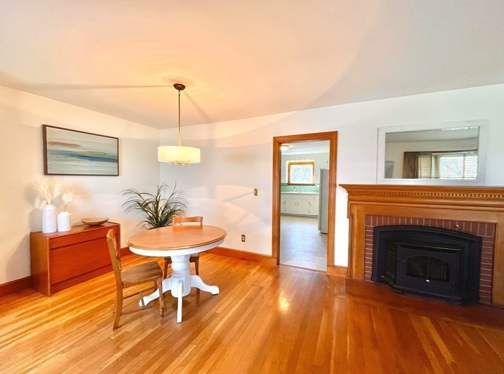 81 Topsfield Road Ipswich, MA 01938 - Photo 3 of 32 a living room with furniture and a fireplace