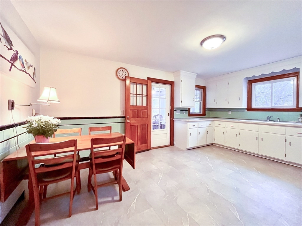 81 Topsfield Road Ipswich, MA 01938 - Photo 5 of 32 a kitchen with stainless steel appliances kitchen island granite countertop a stove a sink and a refrigerator