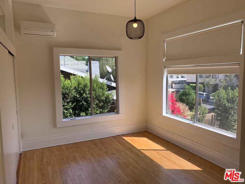 1107 Waterloo Street Los Angeles, CA 90026 - Photo 2 of 20 a view of an empty room with a window