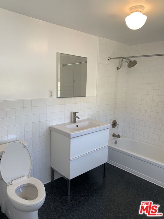 1107 Waterloo Street Los Angeles, CA 90026 - Photo 4 of 20 a bathroom with a sink mirror vanity and toilet