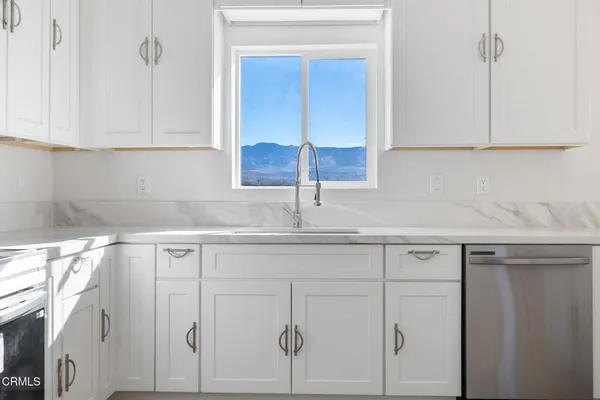 a kitchen with a sink and cabinets