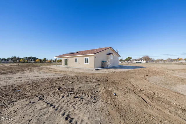 a stone house with wooden floor