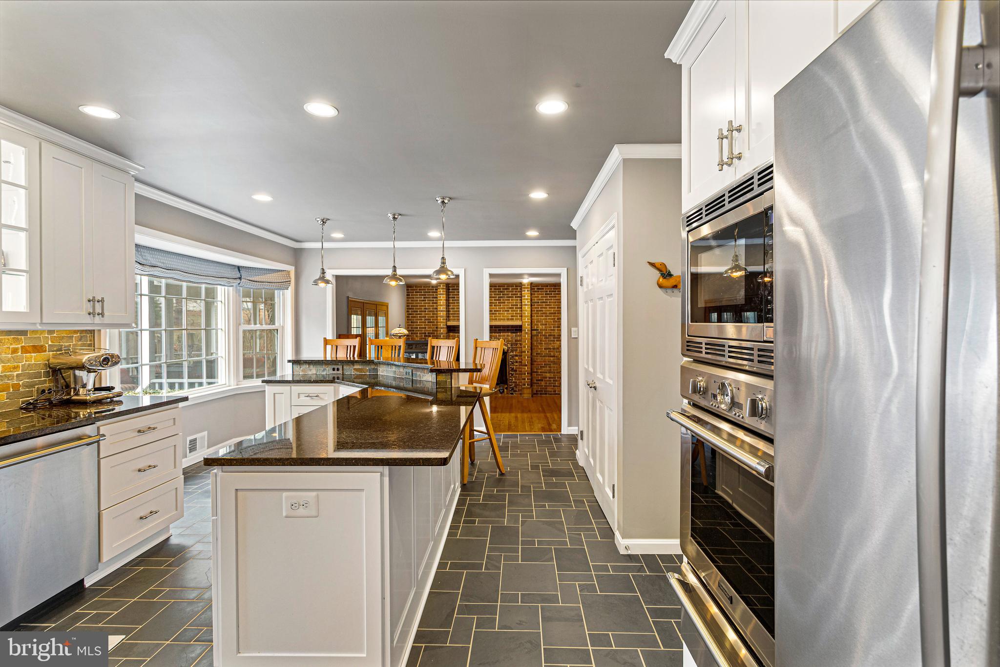 10904 Equestrian Court Reston, VA 20190 - Photo 14 of 81 a kitchen with stainless steel appliances granite countertop a refrigerator and a sink